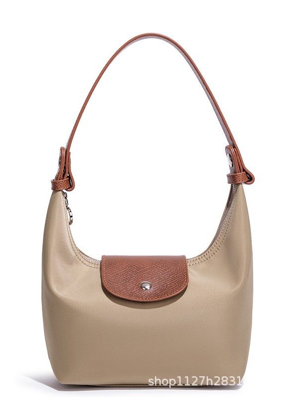 Waterproof Nylon Dumpling Shoulder Bag in Cream Yellow — interior view