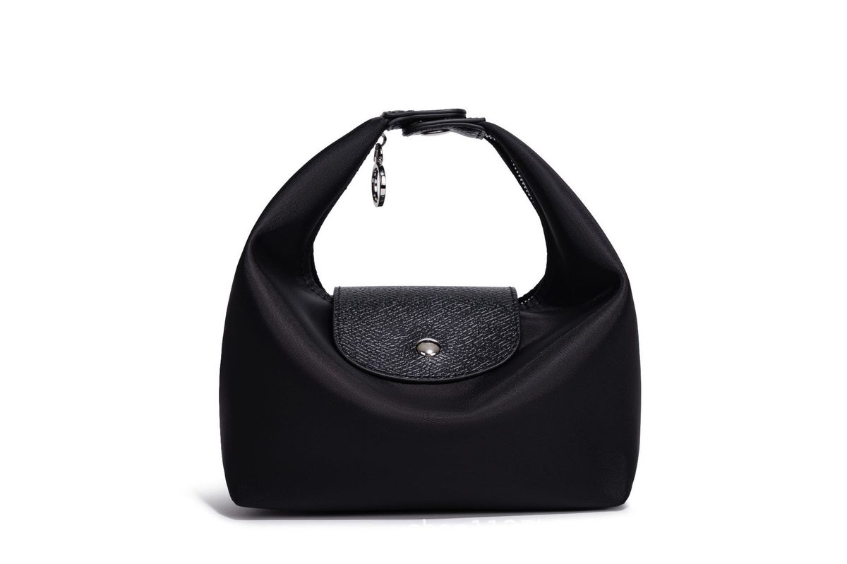 Waterproof Nylon Dumpling Shoulder Bag in Cream Yellow — styling photo