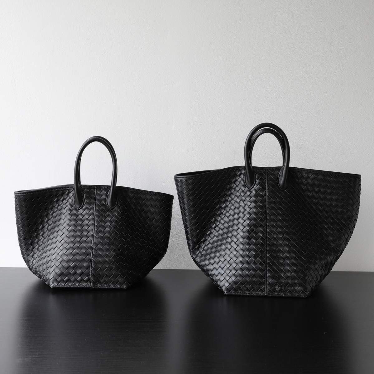 Woven Wing Leather Tote Bag in Beige — worn on shoulder